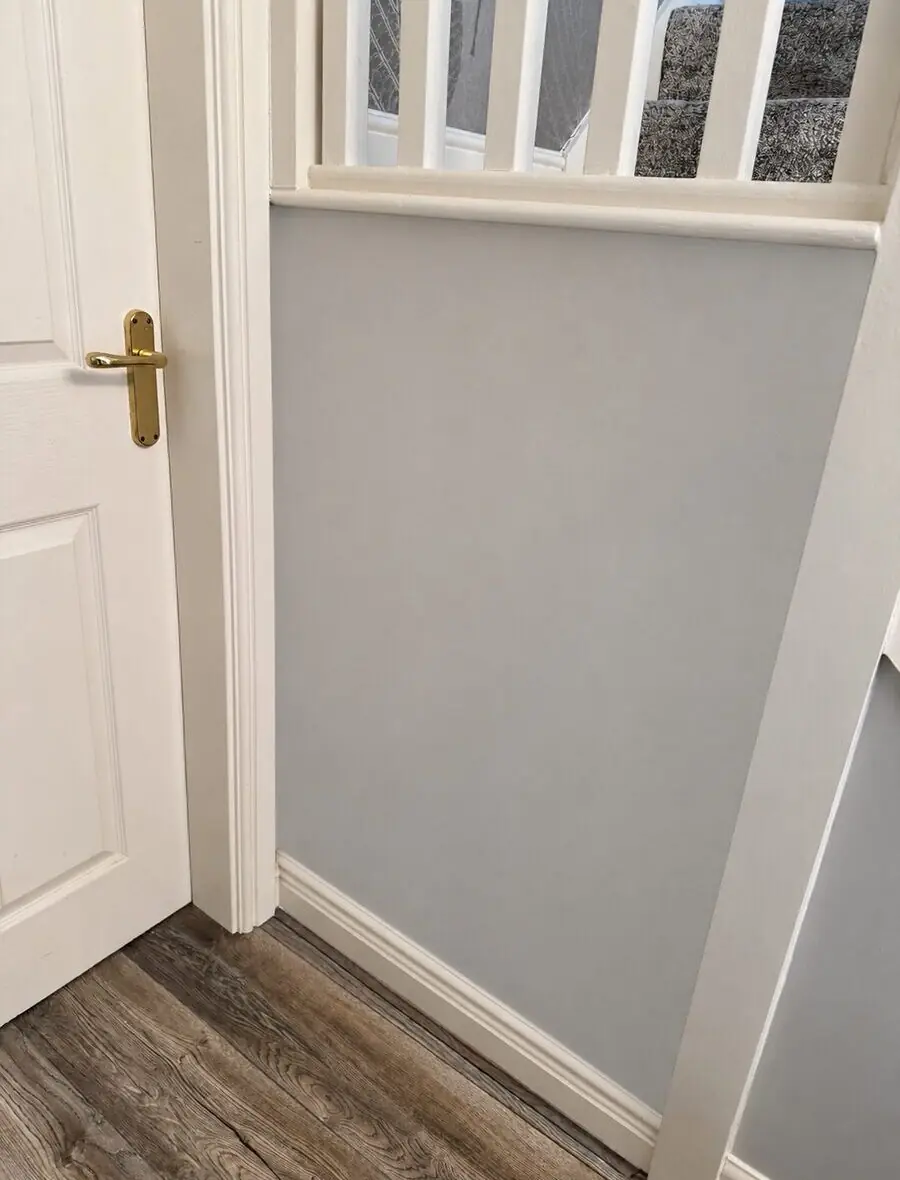 After - bespoke boxed-in storage flush with panelling