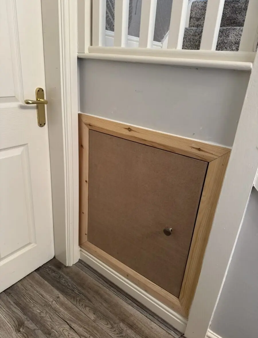 Before - exposed under-stairs void
